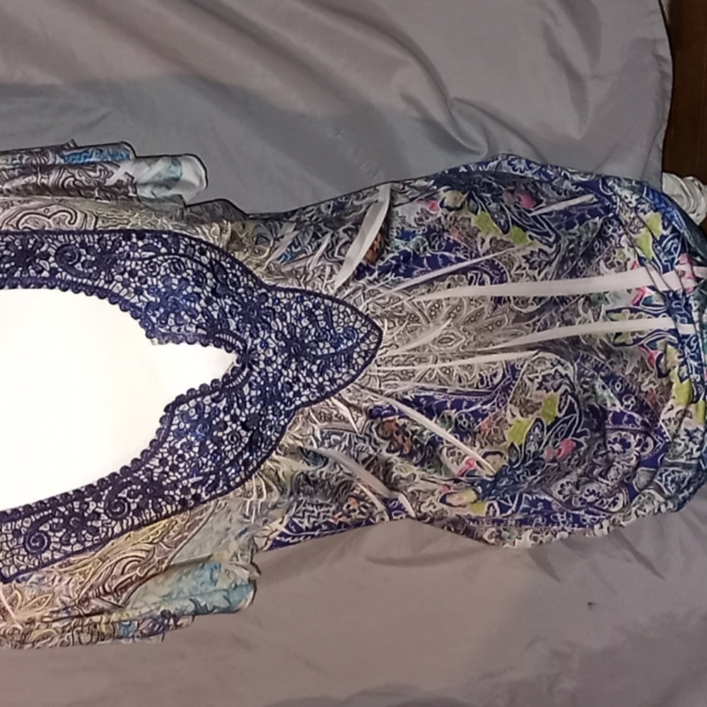 This is a dressy short sleeve 1x sized pretty top.brand is energ world wear